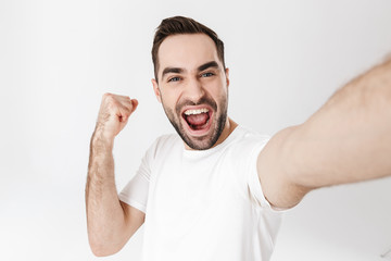 Wall Mural - Handsome cheerful man wearing blank t-shirt