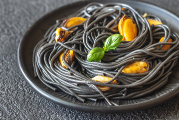 Canvas Print - Black pasta with mussels and parmesan