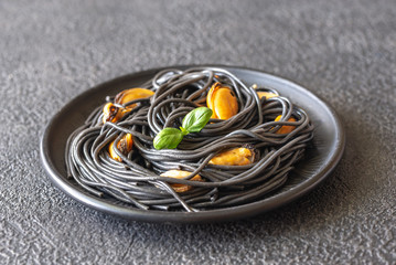 Canvas Print - Black pasta with mussels and parmesan