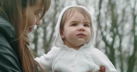 beautiful mother and her baby daughter exploring the outdoors