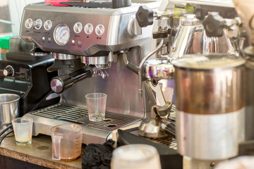 Coffee machine ready to make good a cup of espresso in cafe. coffee machine making a cup of coffee in restaurant. coffee machine preparing cup.