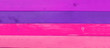 Pink! Brightly painted wood, in pinks and purple, as a wooden background panorama..