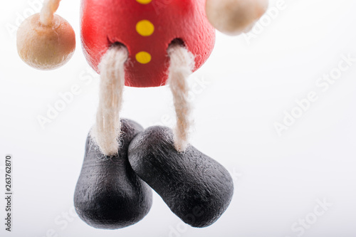 Wooden Pinocchio doll  with legs in view