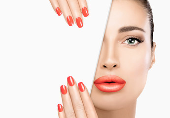 Wall Mural - Beauty woman face closeup. Manicured nail. Full lips. Perfect skin.