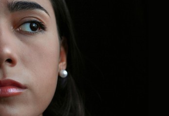 portrait of young woman with black background. Stop violence femme