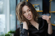 © ierehon74 - attractive and cheerful young woman smiling in cafe