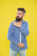 © be free - Shake it off. Summer hipster. Brutal bearded hipster in checkered shirt brush dust off shoulder. Male fashion. Pedantic man with beard on yellow backdrop. Mature man. Everything must be perfect