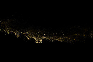 Wall Mural - golden powder explosion on black background. freeze motion.