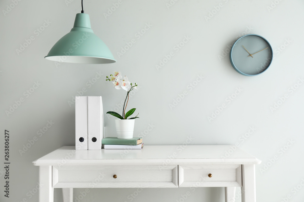 Table near light wall in room