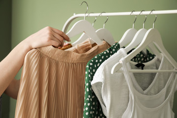 Woman choosing clothes in dressing room