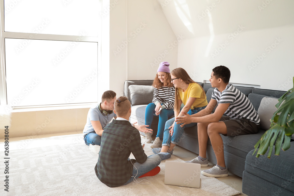 Group of teenagers spending time at home