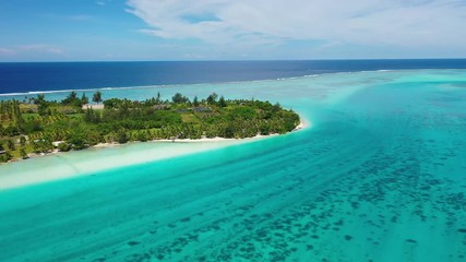 Wall Mural - French Polynesia Tahiti aerial drone view of motu with perfect beach by island Huahine, coral reef lagoon and Pacific Ocean. Tropical travek paradise.