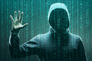 Wall Mural - Computer hacker in mask and hoodie over abstract binary background. Obscured dark face. Data thief, internet fraud, darknet and cyber security.