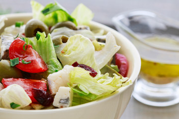 Canvas Print - Vegetable salad with tomato, cheese and olives.