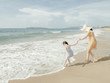© MaaHoo Studio/Stocksy - Cute toddler girl and her mother on the seaside
