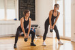 © brkati krokodil/Stocksy - Woman Working Out With A Fitness Instructor