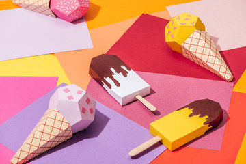 Sticker - various handmade origami ice cream on multicolored paper