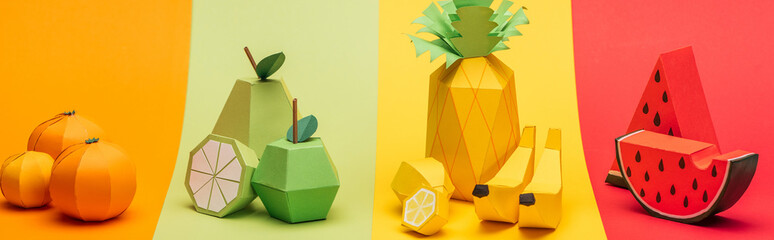 Sticker - panoramic shot of various handmade origami fruits on stripes of colorful paper