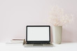 © Floral Deco - Laptop and flowers bouquet on pink background. Front view minimal modern home office desk workspace. Blank screen mock up hero header. Blog, social media, website template. Girl boss concept.