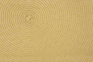 Woven yellow wicker straw background or textur