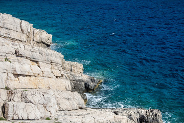 Beautiful white rock sea coast and the blue sea