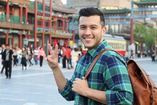 Young Man In Asia Showing Peace Sign