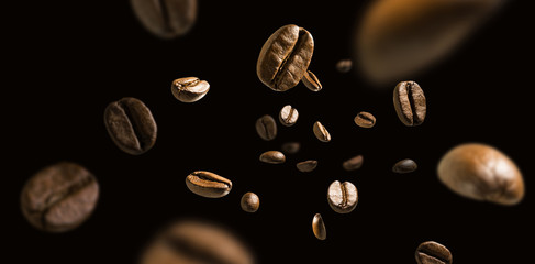 Coffee beans in flight on a dark background