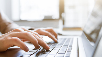 Website technical content writer. Network service. Social media blogging. Closeup of hands typing on laptop, creating new article.