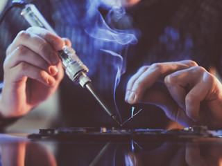 soldering courses. microelectronics engineering and technology concept. technician or student repair