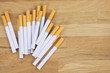 © methaphum - image of several commercially made cigarettes. pile cigarette on wooden. or Non smoking campaign concept, tobacco. top view