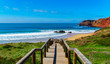 Stairs lead the way down to a surfers beach, Algarve, Portugal