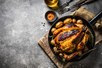 Wall Mural - Baked whole chicken with spices on pan