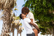 © Samuel B. - Outdoor protrait of black african american couple - Guy carrying girfriend on his back