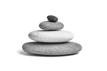 Wall Mural - Stacked smooth grey stones. Sea pebble. Balancing pebbles isolated on white background