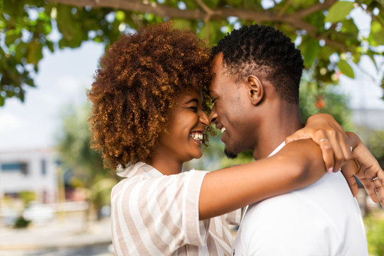 Outdoor protrait of black african american couple kissing each other
