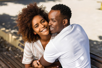 Outdoor protrait of black african american couple embracing each other