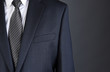© Steve Cukrov - Closeup of a businessman Charcoal Gray Suit with white shirt and tie.