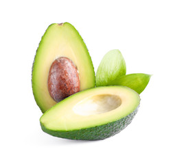 Ripe cut avocado with leaves isolated on white background. Healthy food