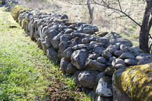 Stone Wall Made Of Gray Stones In Morning Light