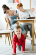 © Photographee.eu - Rude kid sitting under the table during therapy for ADHD with his mother and professional therapist