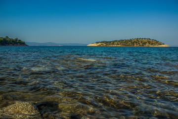 Wall Mural - south European scenic landscape Aegean sea bay picturesque island view with water surface foreground in fresh spring season weather time