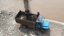 Unloading Sand From A Boat Into A Truck Using A Conveyor Belt In China
