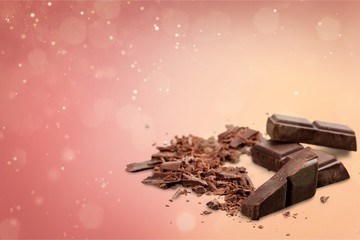 Wall Mural - Pieces of delicious chocolate isolated on white