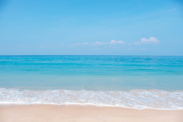 Landscape of tropical beach in summer. Sandy beach with sea waves and blue sky background. Holiday, vacation - Image