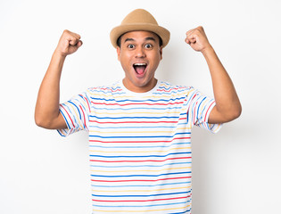 Happy young asian man celebrates with two hand in the air on isolate white background.