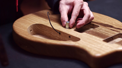 Guitar maker build electrical parts of guitar