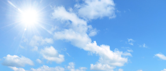 blue sky with sun and white clouds