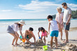 © Blue Jean Images - Happy family having fun on beach