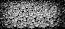Death, Evil, Funeral Or Drama Concept. Background Of Skulls And Bones In The Catacombs.