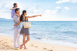 © Blue Jean Images - Happy young family by the sea